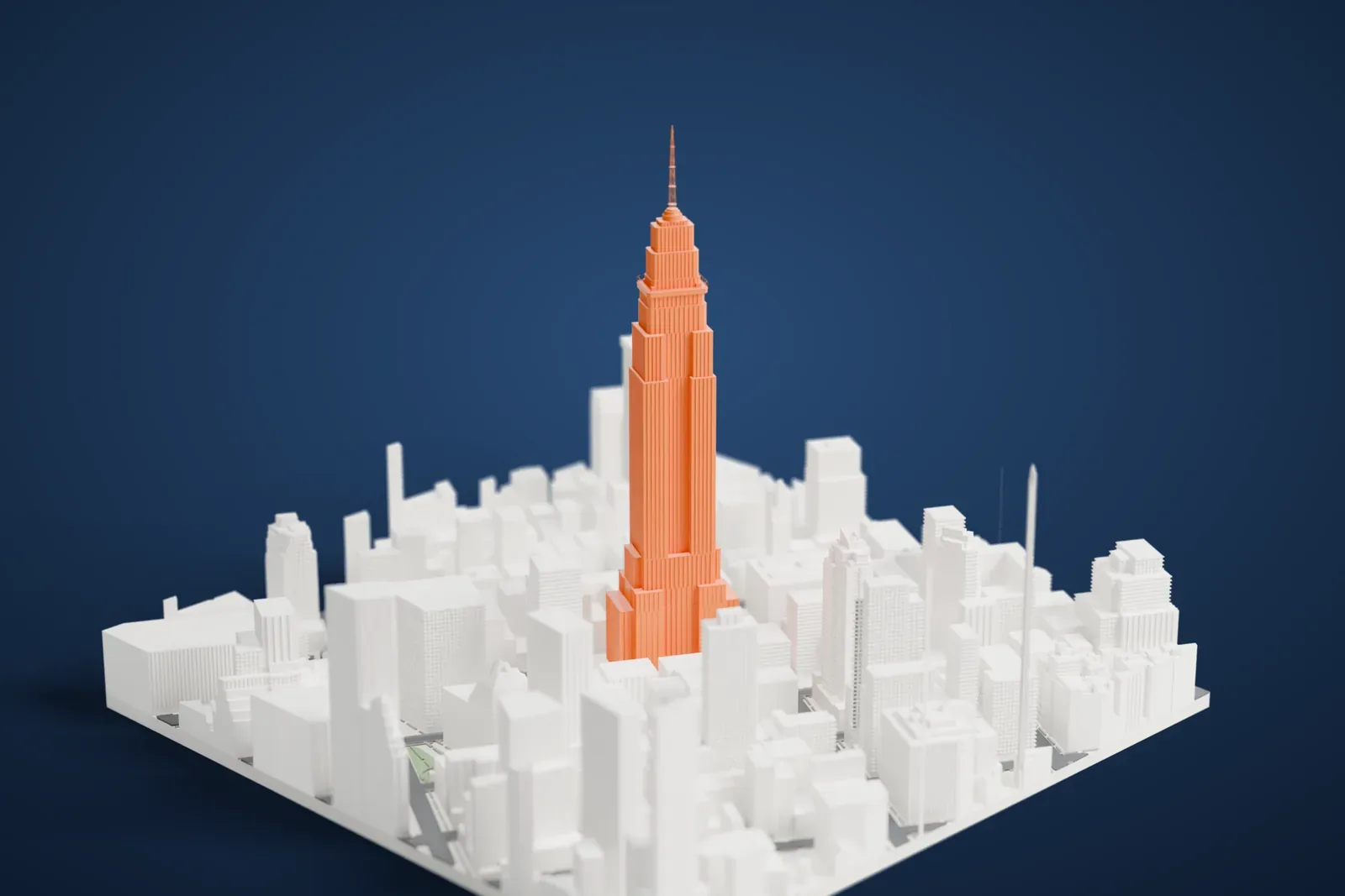 A white 3D print of the Empire State Building, a stepped tower with a slim antenna, rising above the dense blocks and narrow streets of Midtown Manhattan.