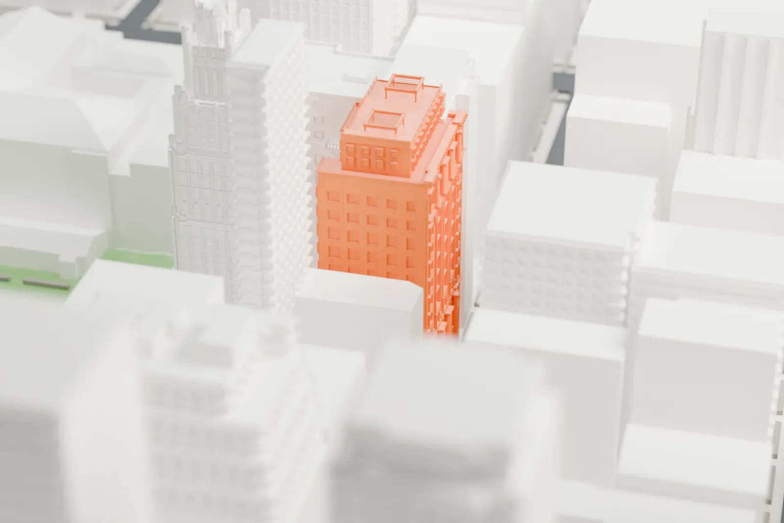 A white 3D print of the Engineering Societies' Building, a mid-rise building with many windows and a flat roof, surrounded by much taller towers.