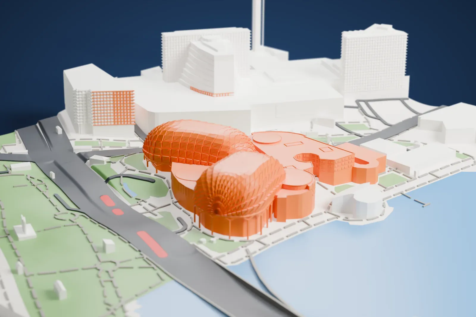 A white 3D print of Esplanade – Theatres on the Bay, two rounded domes covered in a triangular lattice beside the water, with a wide road and green park nearby.