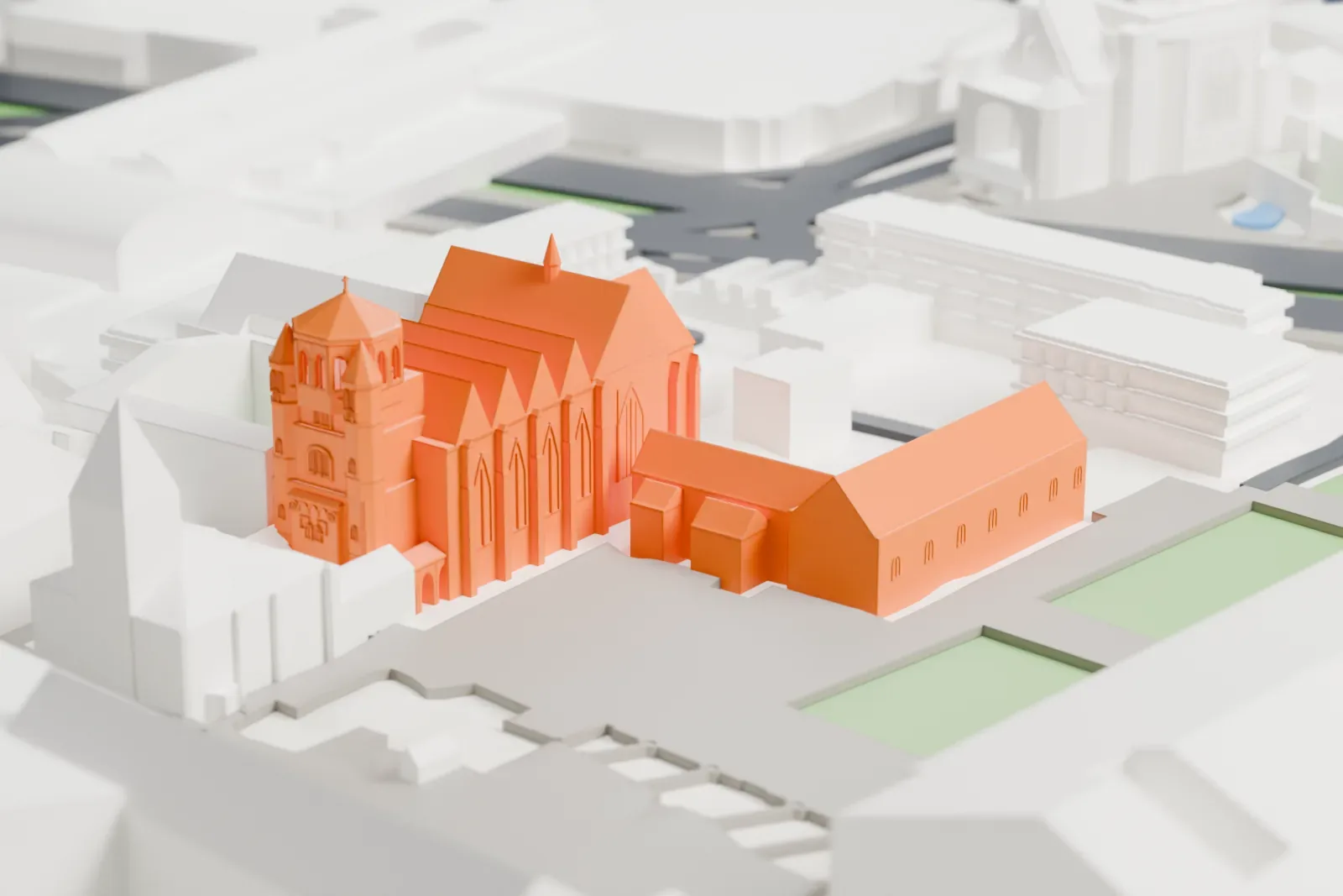 A white 3D print of Essen Minster, a Gothic church with a westwork, among surrounding streets and buildings.