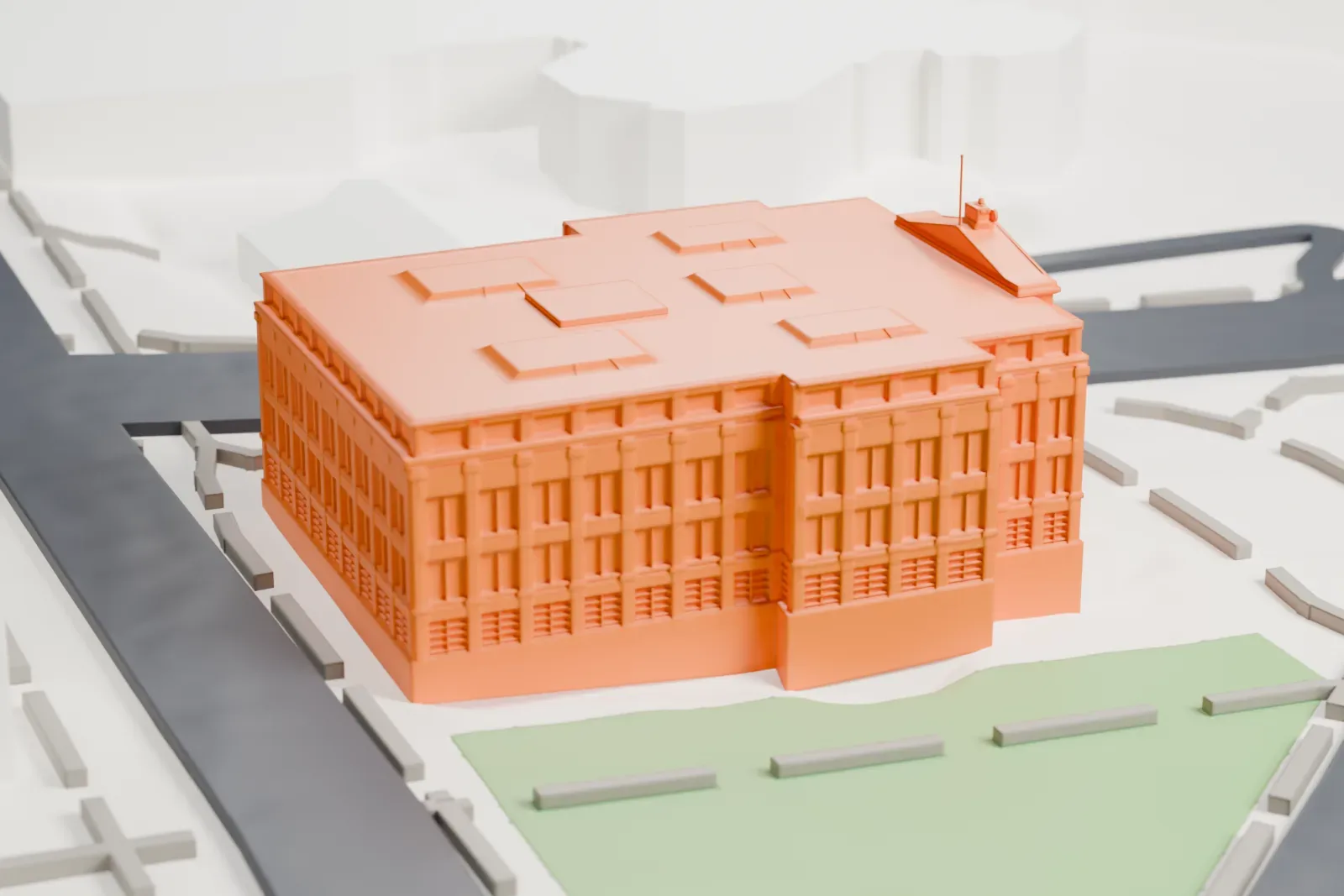 A white 3D print of the Essex County Courthouse, a block with a columned entrance and skylights on the roof, between streets and lawns.