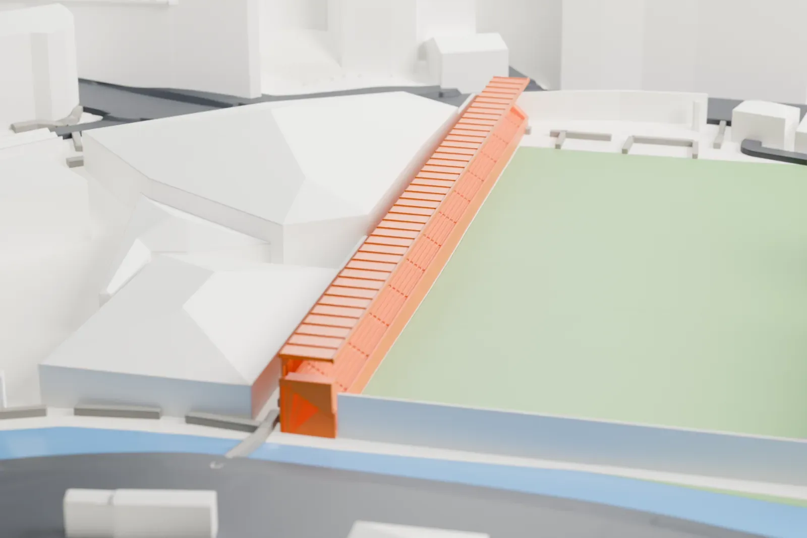A white 3D print of the Estadi Nacional's long covered stand, with a flat canopy on slender columns above a stepped seating rake, among surrounding streets and buildings.