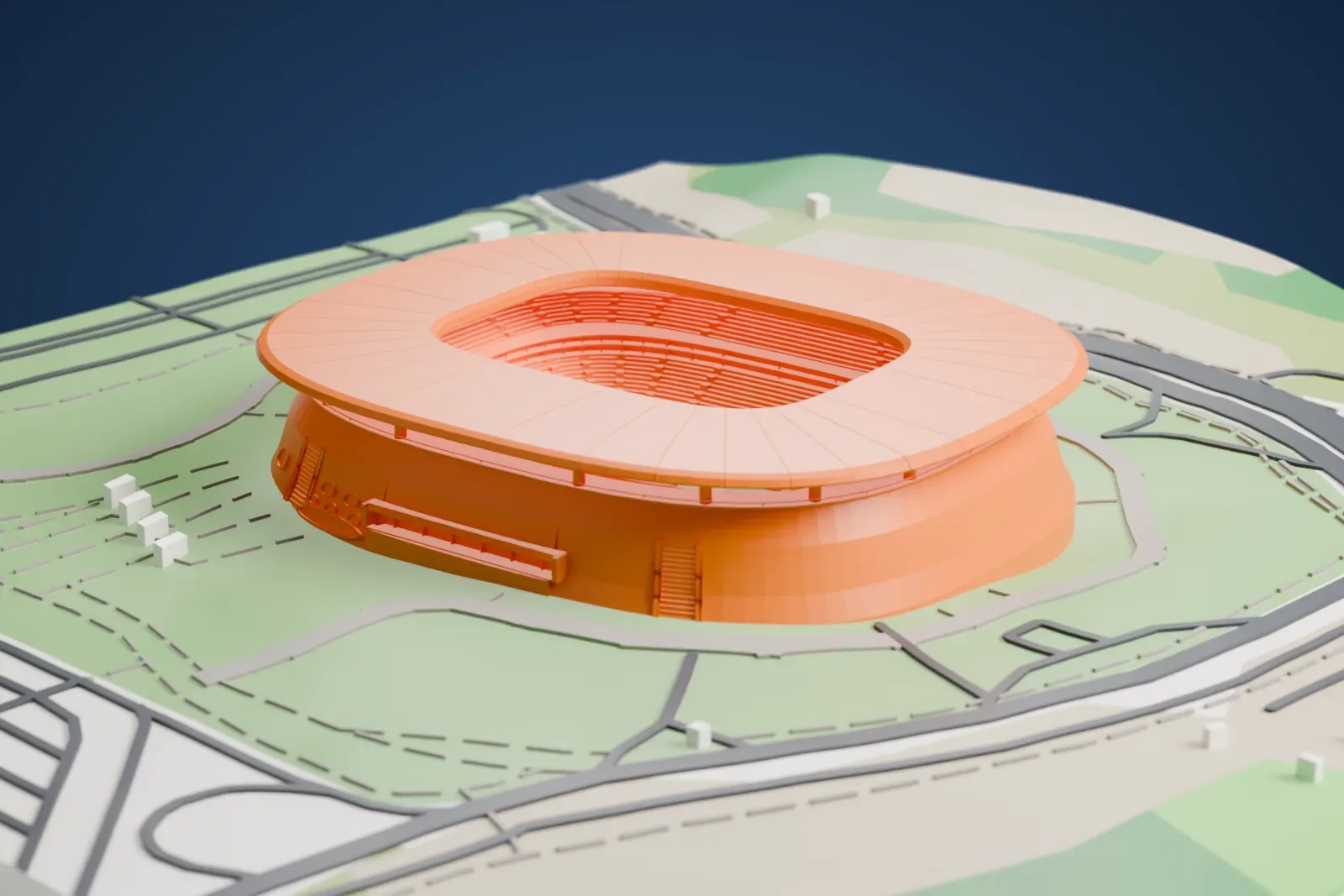 A white 3D print of Estadio Akron, a rounded stadium with a broad ring-shaped roof and smooth sloping walls, set in green lawns with winding paths and roads.