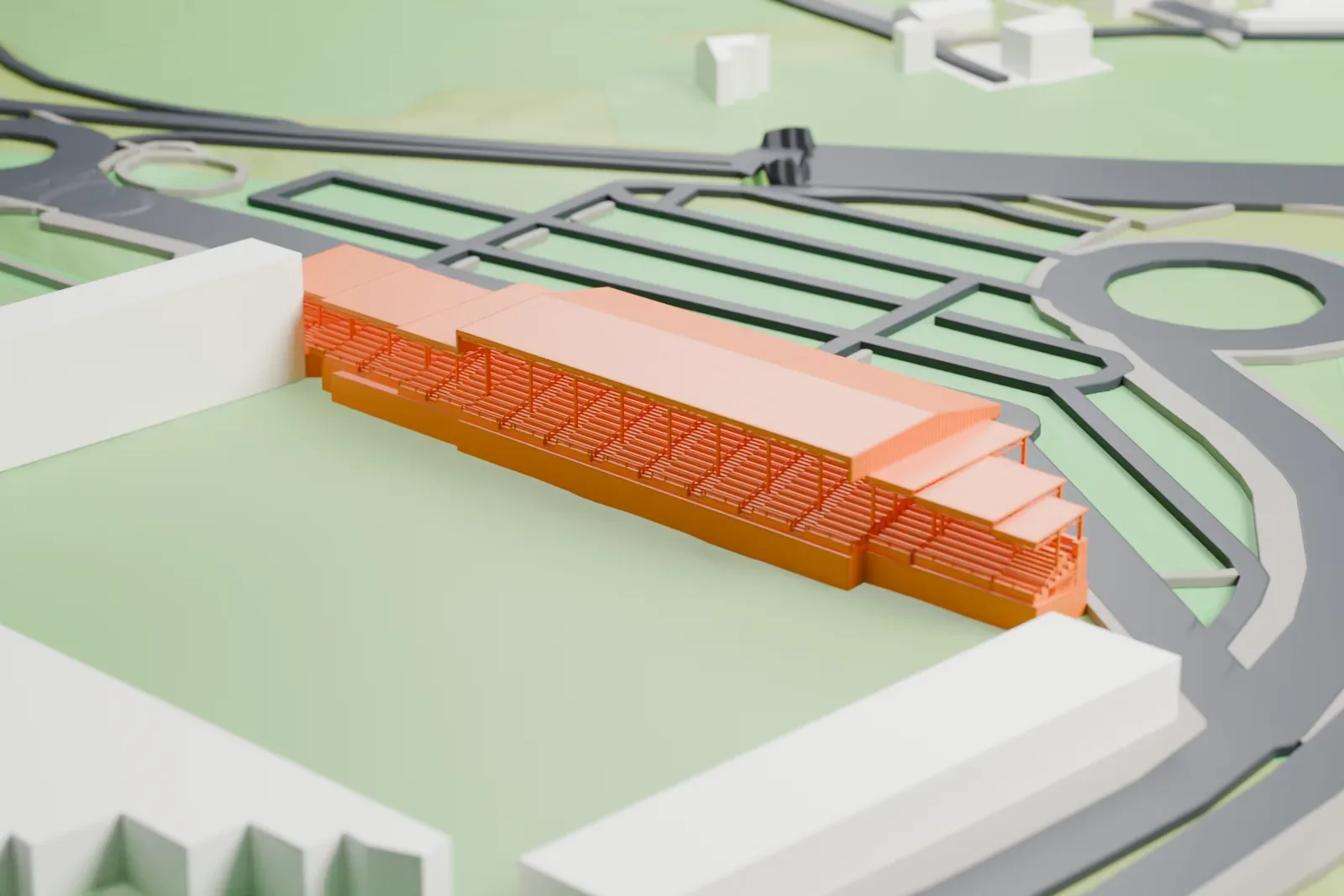 A white 3D print of Estadio Anxo Carro, a football stadium with a long gabled main stand and smaller roofed stands, among surrounding roads and green areas.
