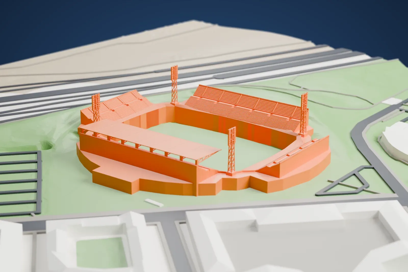 A white 3D print of Estadio Coliseum, a low football stadium, among the surrounding streets and buildings of Getafe.