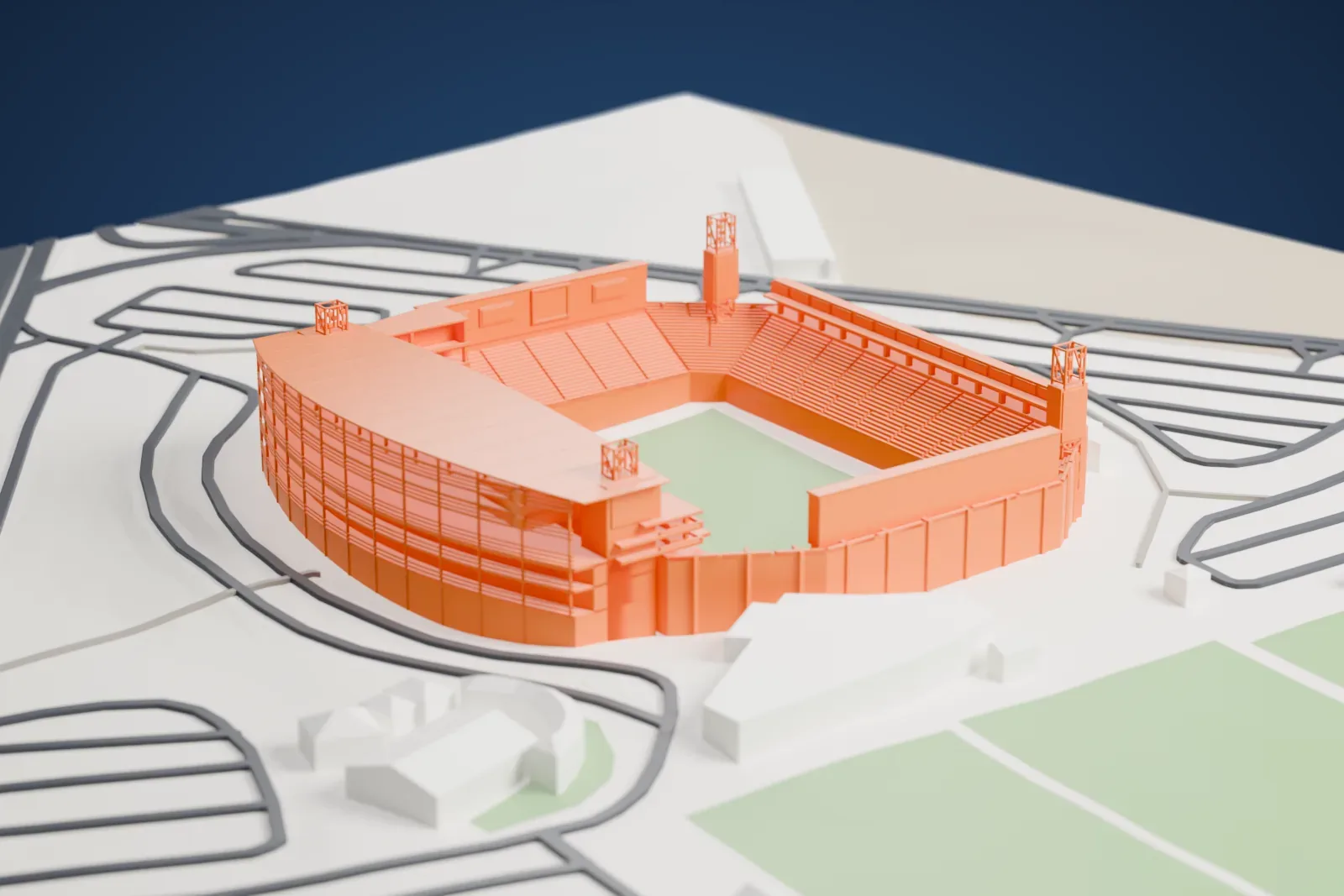 A white 3D print of the Estadio Corona, an open stadium bowl with a tall main stand, a thin curved canopy and four floodlight masts, among the surrounding streets and buildings of Torreón.