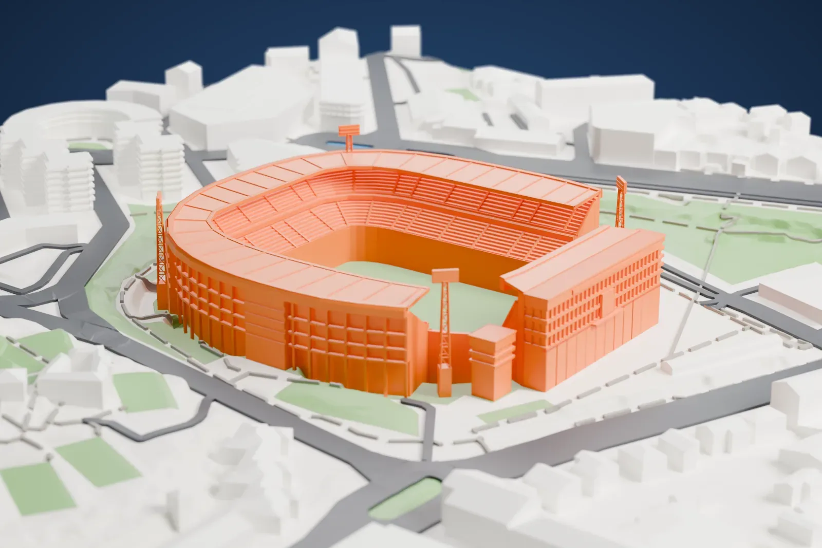 A white 3D print of the Estádio D. Afonso Henriques, a low bowl with a flat ring roof, a separate enclosed block at one end and four lattice towers, among surrounding streets and buildings.