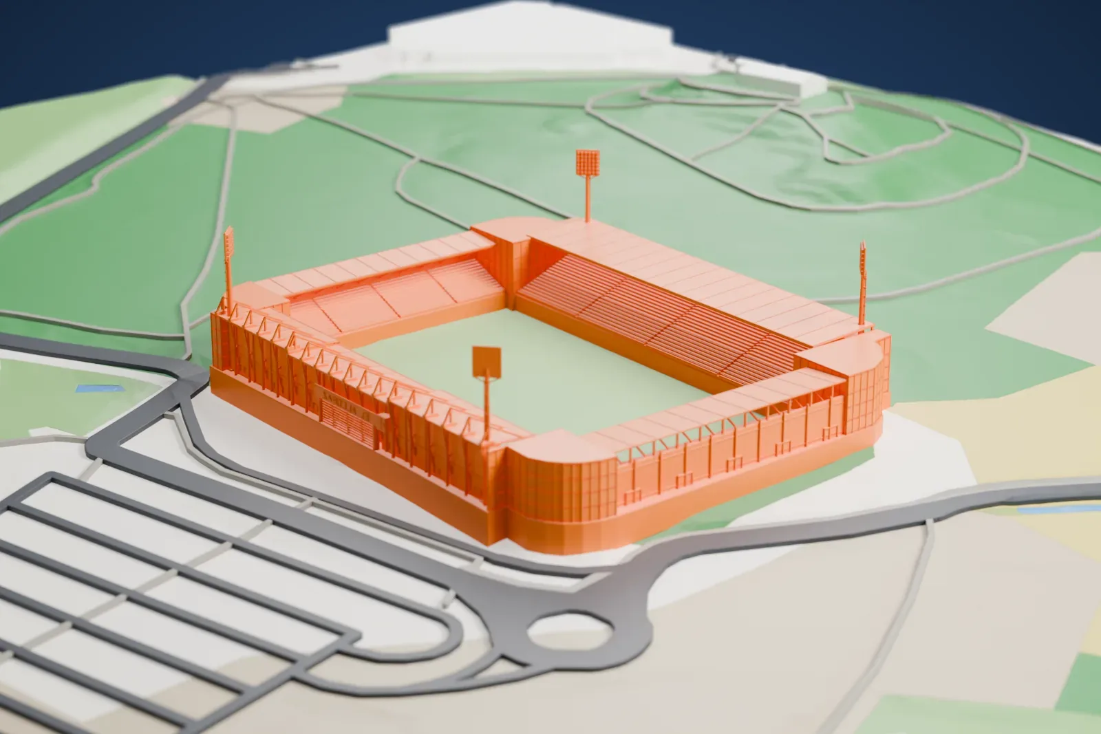 A white 3D print of Estadio El Alcoraz, a football stadium with a covered stand and four floodlight towers, surrounded by green slopes, roads and parking lots.