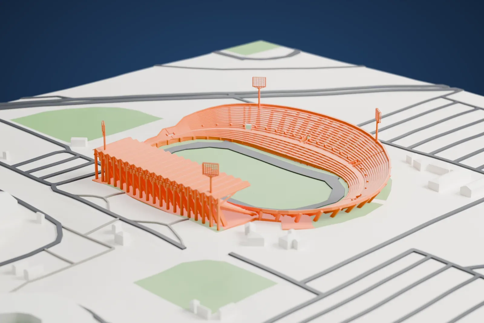 A white 3D print of Estadio José Pachencho Romero, an oval stadium with curved stands and four floodlight towers around a green pitch, among surrounding streets and open ground.