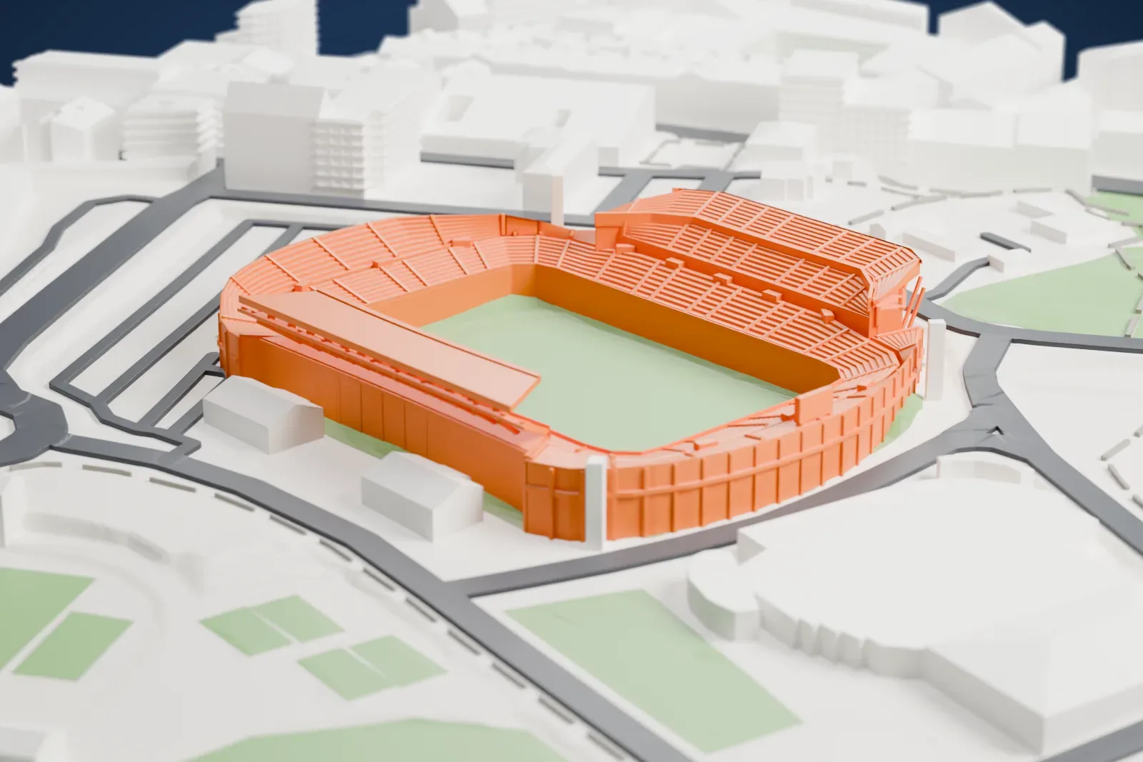 A white 3D print of the Estadio José Rico Pérez, an open bowl with a flat-roofed main stand on one side and a taller uncovered stand on the other, on a base of surrounding streets and buildings.