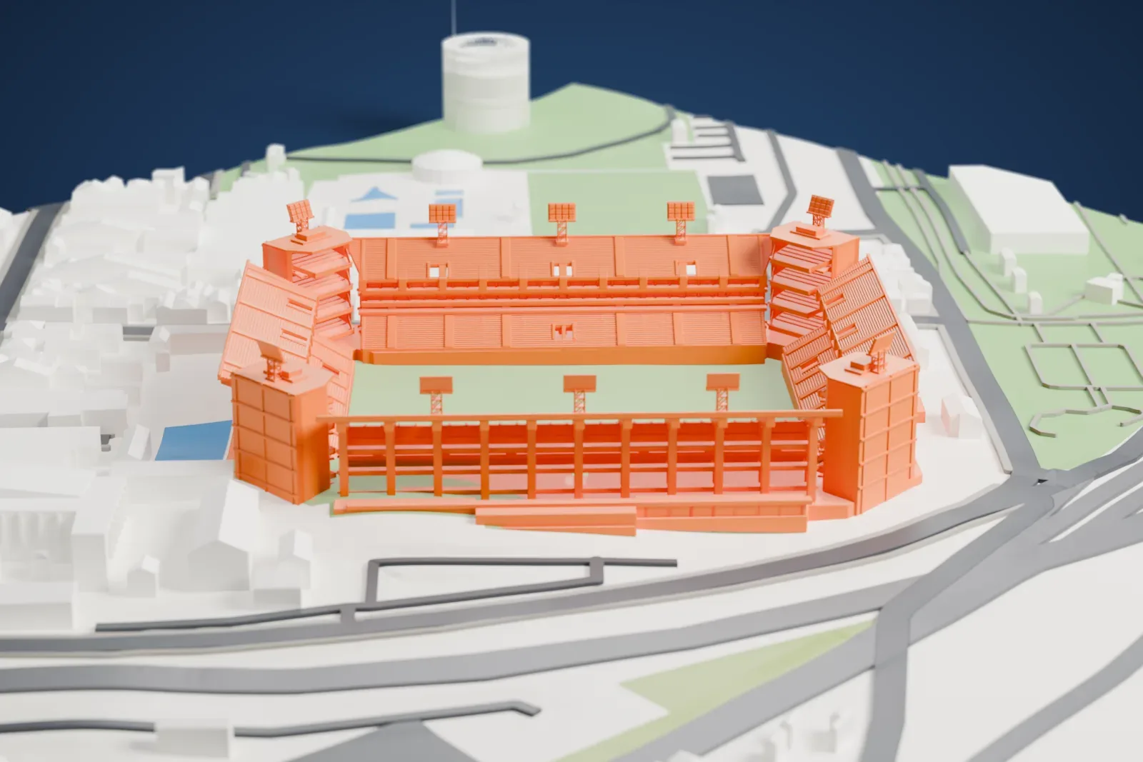 A white 3D print of the Estadio Libertadores de América, an open rectangular football ground with tall corner towers, among the streets and buildings of Avellaneda.