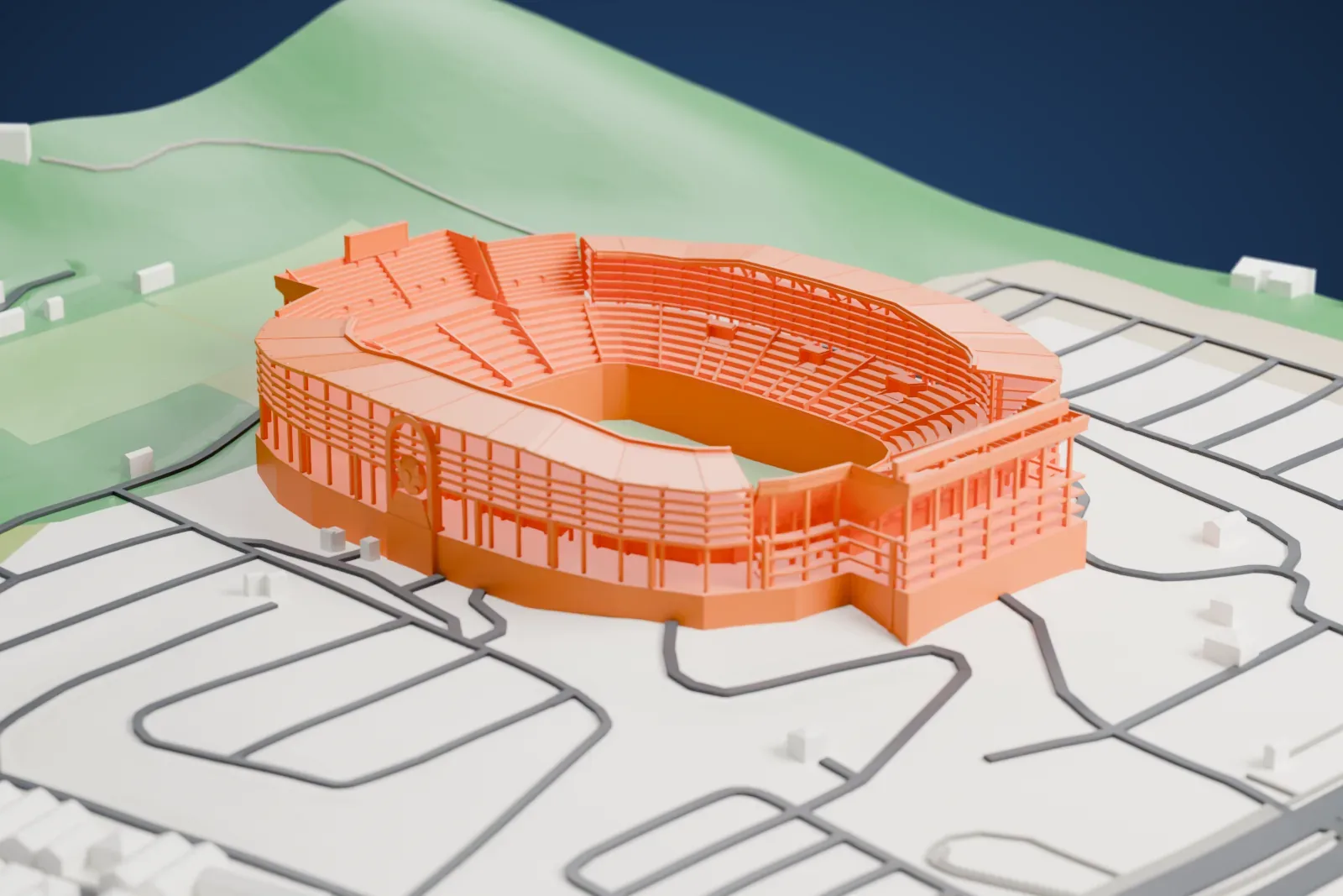 A white 3D print of the Estadio Monumental Isidro Romero Carbo, an open bowl with steep terraces, five gallery levels, two side canopies and a tall entrance arch, among the surrounding streets and buildings of Guayaquil.