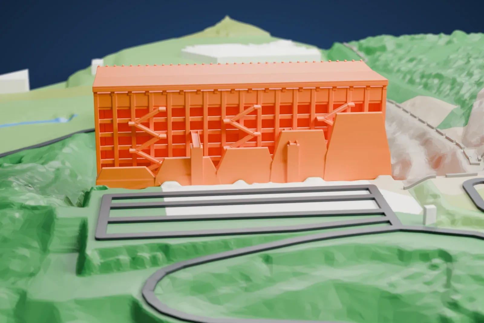 A white 3D print of the Estádio Municipal de Braga, a long two-tier side stand under a thin folded roof with stepped rock rising behind it, on a base of surrounding streets and buildings.