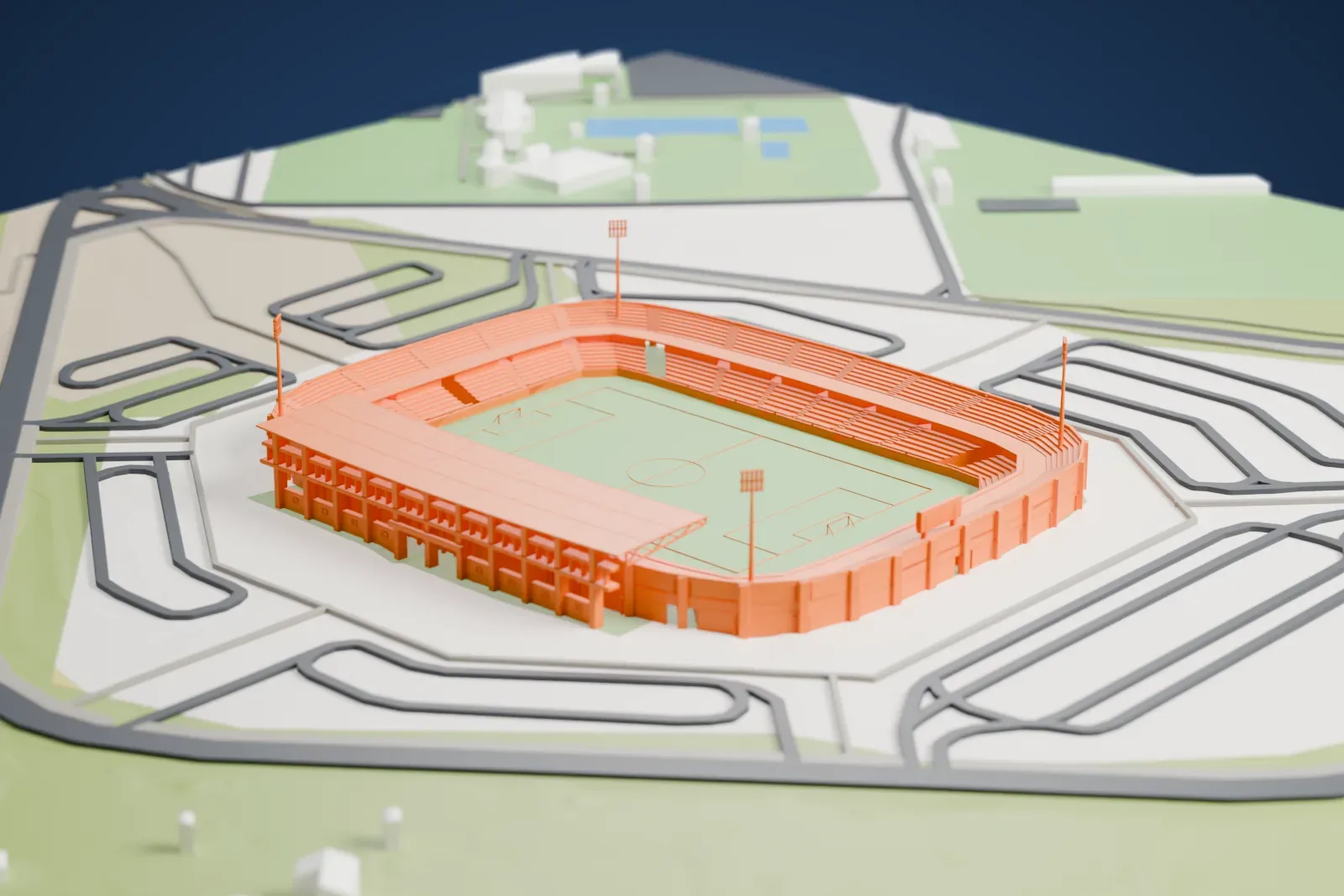 A white 3D print of Estadio Nuevo Vivero, a rounded stadium with a large roof over one stand and four floodlight masts, ringed by looping roads and open ground.