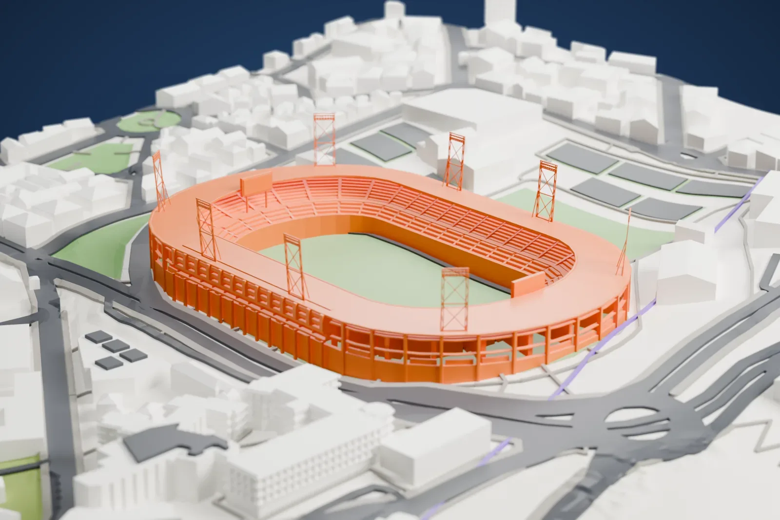 A white 3D print of Estadio Palogrande, a large oval stadium with a roof ring and four tall floodlight towers around a green pitch, among surrounding streets and buildings.