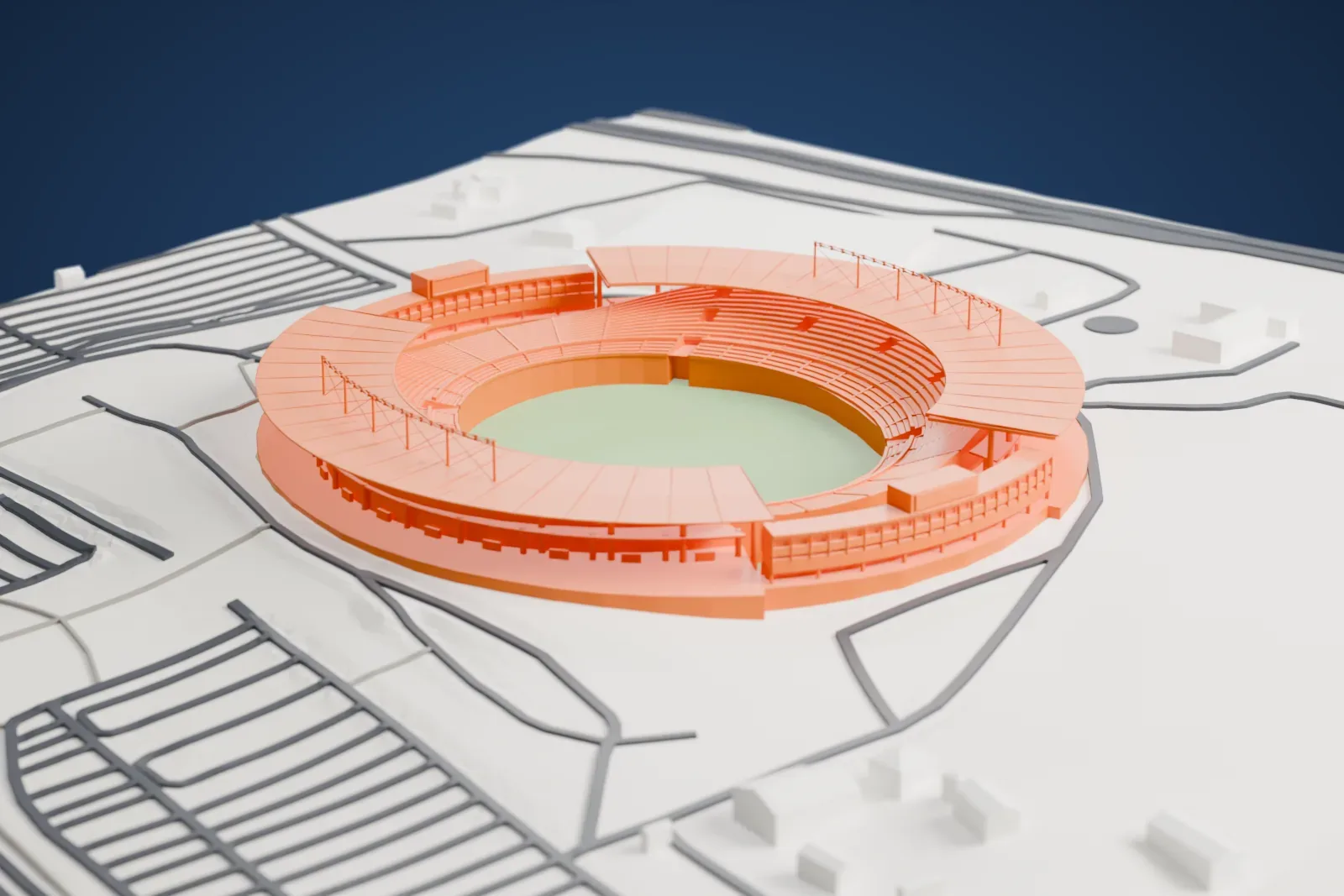 A white 3D print of Estádio Serra Dourada, an oval stadium with canopy roofs over its stands and a green pitch, among surrounding streets and a few buildings.