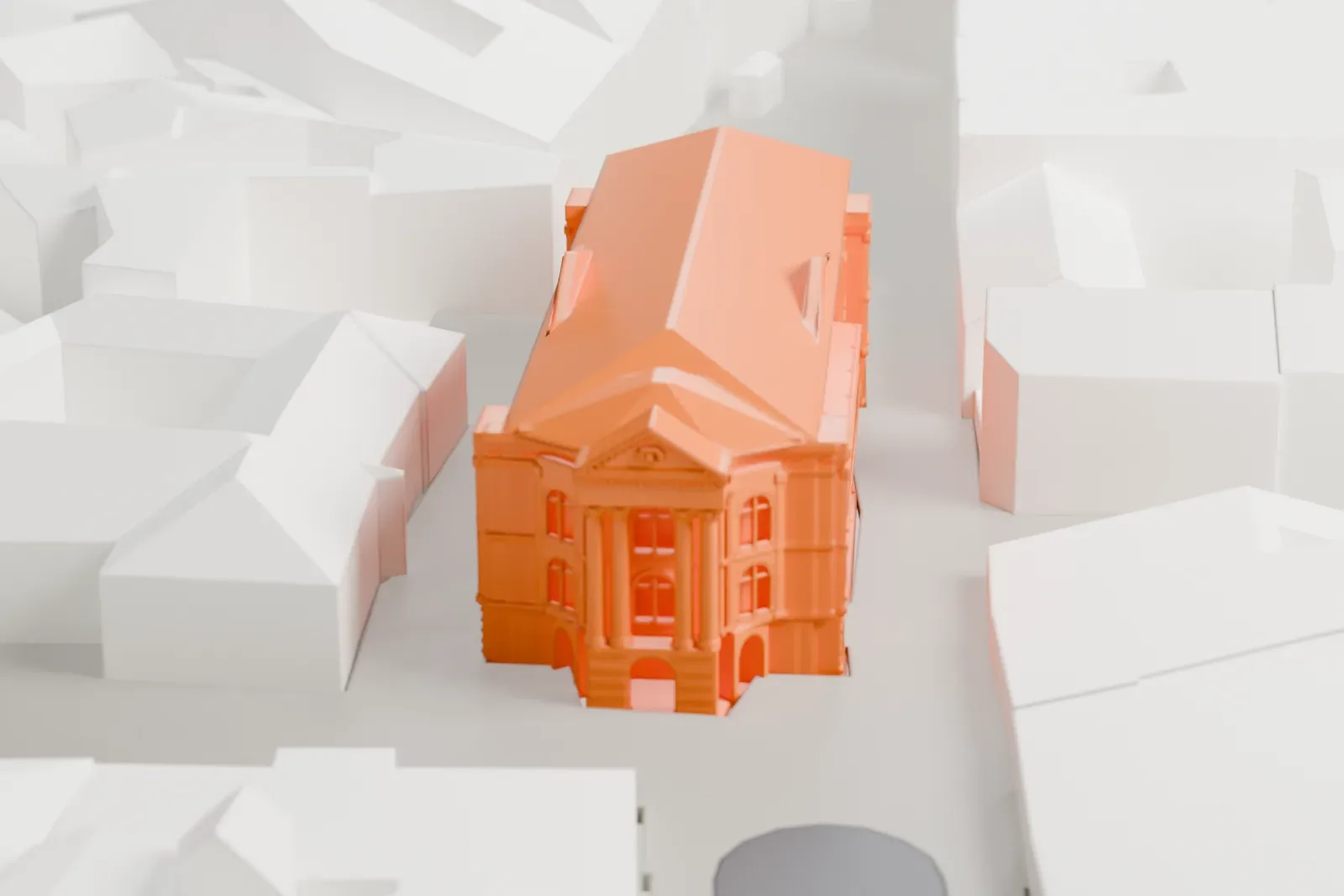 A white 3D print of the Estates Theatre, a Neoclassical building, among the surrounding streets and buildings of Prague.