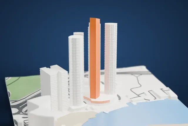A white 3D print of the Etihad Tower 2 model in Abu Dhabi, with the streets around it.