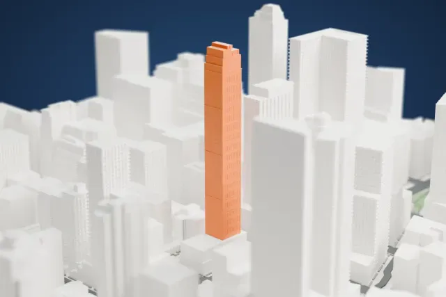 A white 3D print of the Eventi model in New York, with the streets around it.