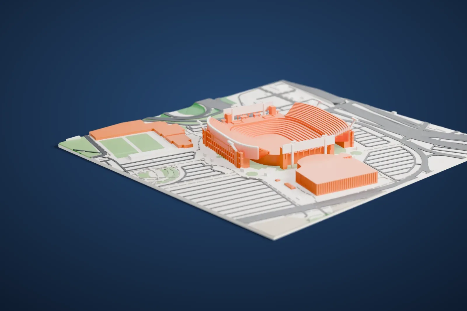 A white 3D print of EverBank Stadium, an open bowl of stepped seating, surrounded by roads, large paved areas and a few green fields.