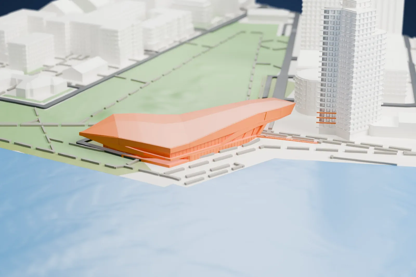 A white 3D print of Eye Filmmuseum, a long, angular building with sharply faceted roof planes, standing at the water's edge beside green parkland and tall buildings.