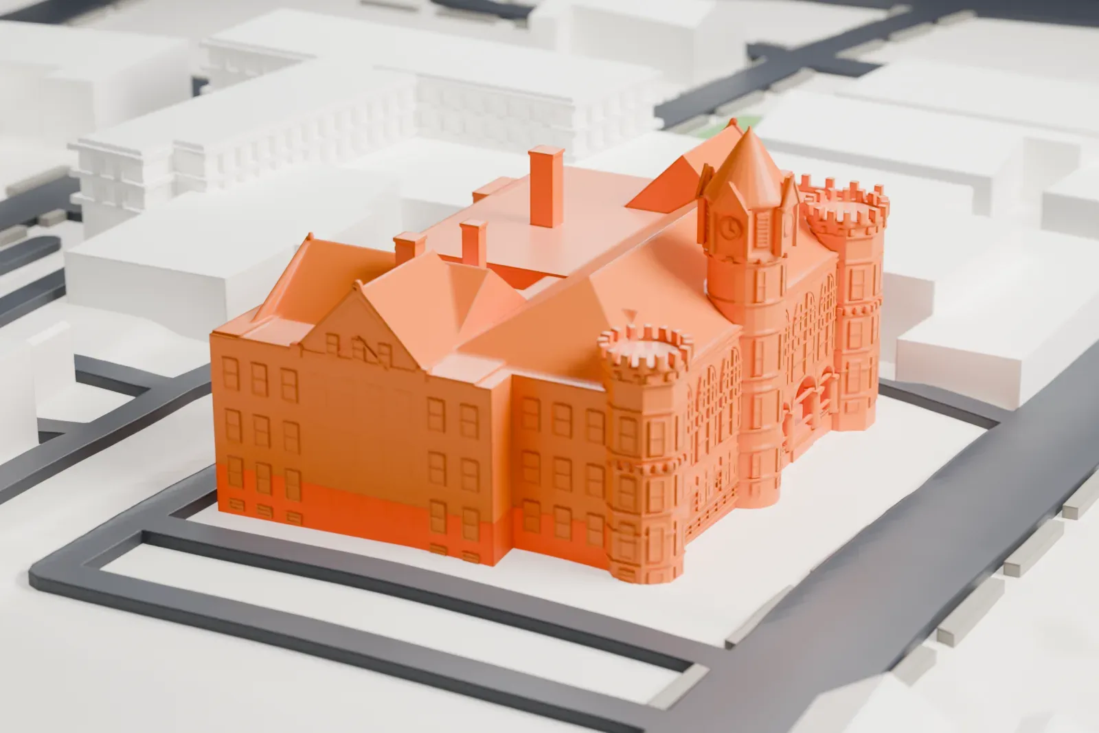 A white 3D print of the Fairfield County Courthouse, a large building with a central tower and round corner turrets, surrounded by streets and other buildings.