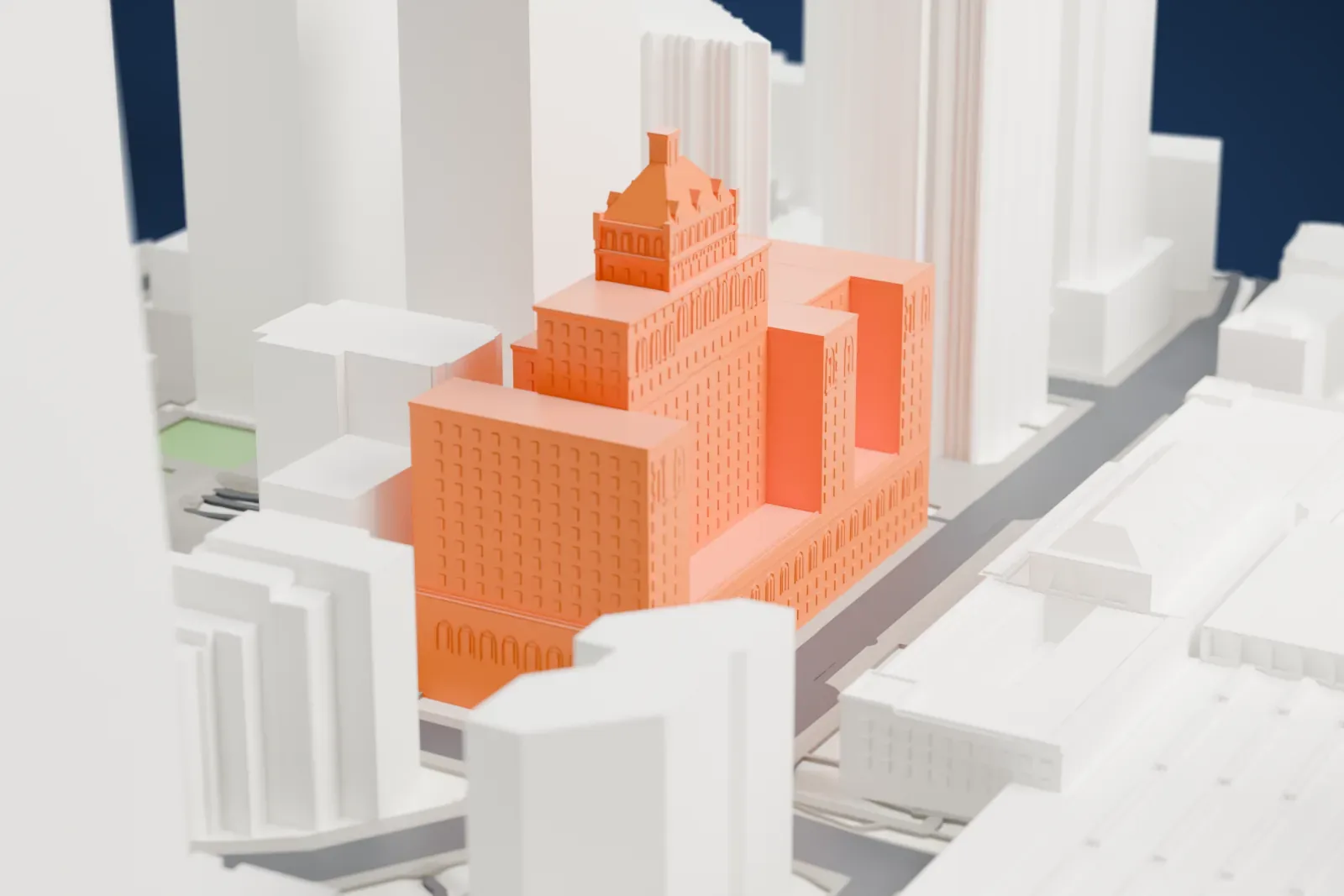 A white 3D print of the Fairmont Royal York, a tall hotel block with a steep pitched roof, standing among the surrounding streets and buildings.