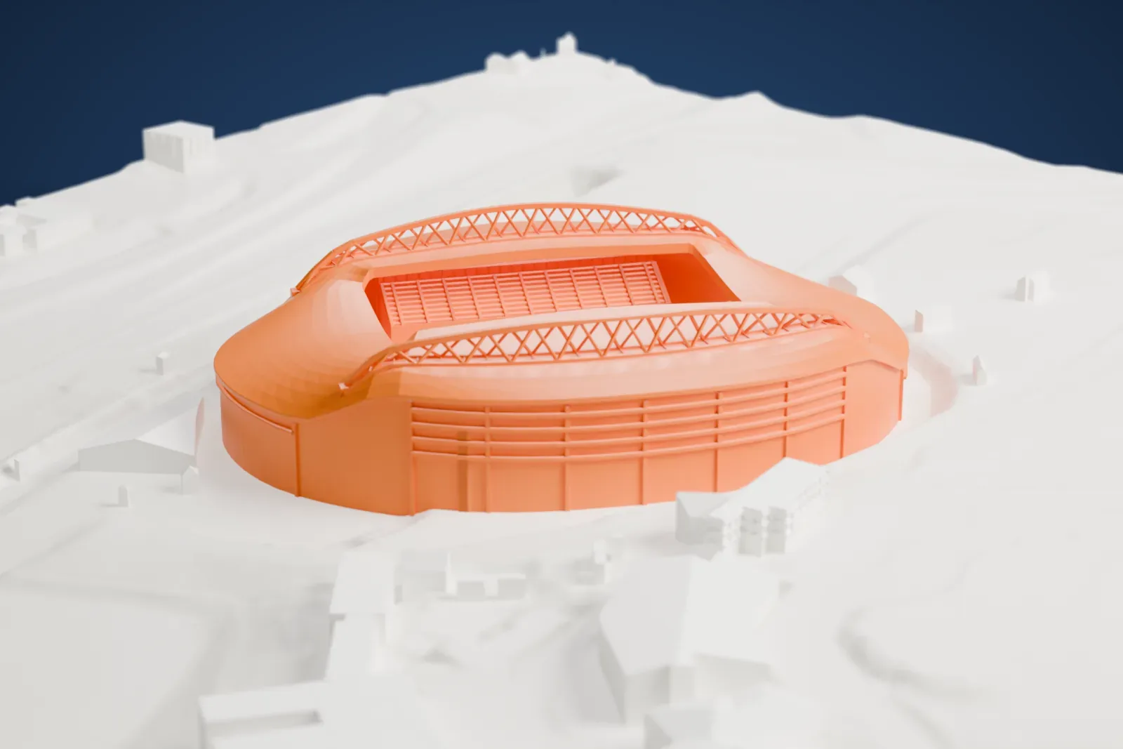 A white 3D print of Falmer Stadium, an oval bowl with two arched trusses over its roof, surrounded by streets and buildings.