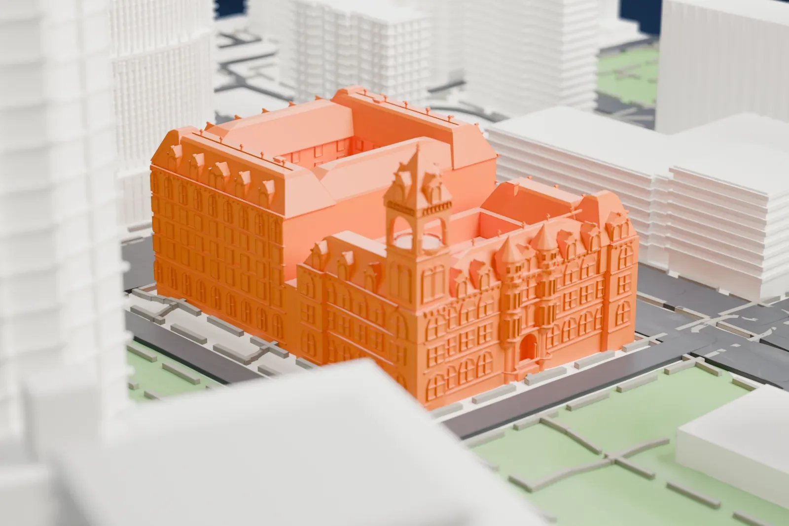 A white 3D print of the Federal Building and Post Office, a large building with a corner tower, small conical turrets and many dormers, beside green park lawns and wide roads.