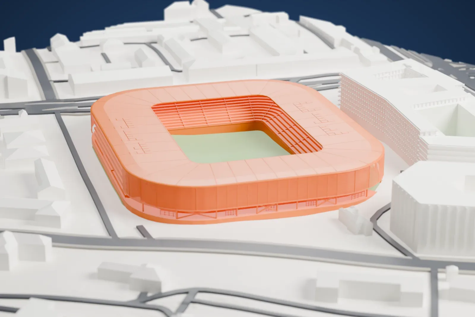 A white 3D print of the Ferencváros Stadion, a rounded stadium wrapped in a fine mesh screen under a low roof ring, among surrounding streets and buildings.