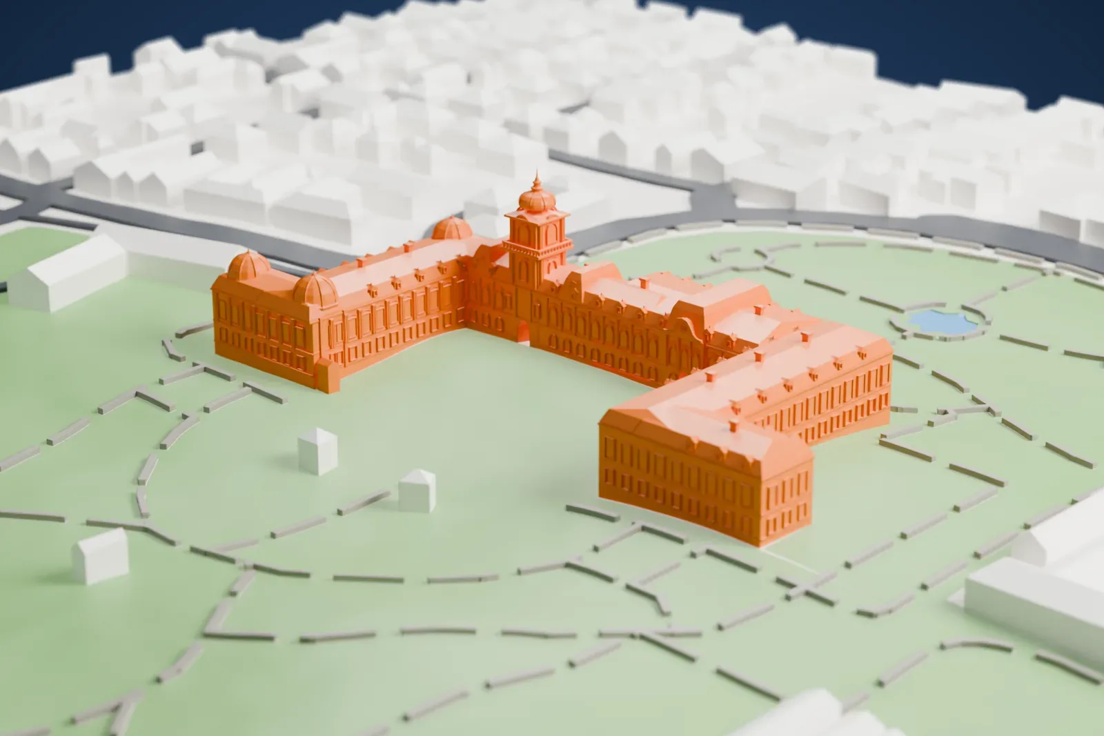 A white 3D print of Festetics Palace, a long palace with domed corner pavilions and a central tower, set in park lawns with winding paths and small ponds.