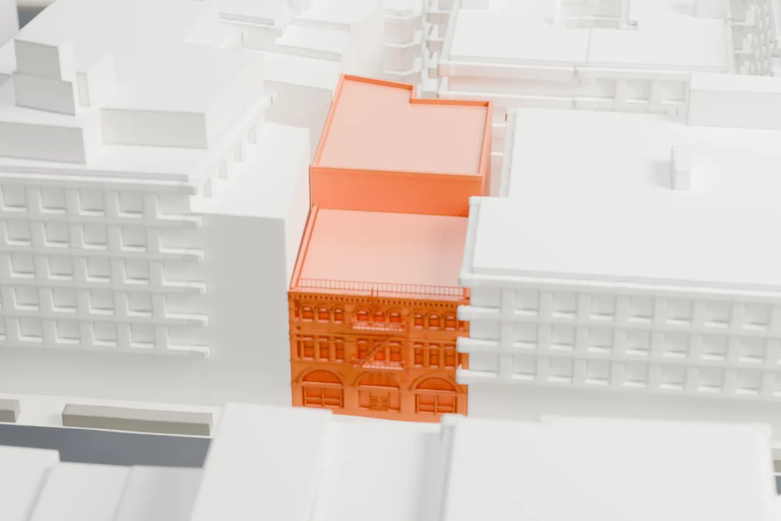 A white 3D print of the Feuchtwanger Stable, a three-story building with a flat roof, closed in by taller buildings on a city block.