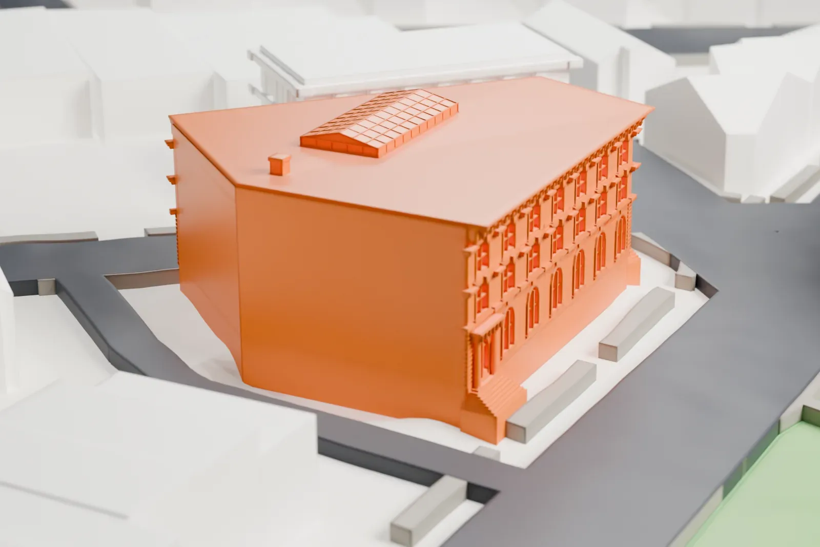 A white 3D print of Ficken's Warehouse, a large block with arched ground-floor windows and a rooftop skylight, on a corner beside a green space and streets.