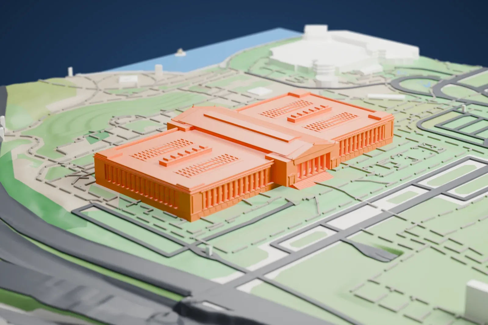 A white 3D print of the Field Museum, a long, low building with a central block and two colonnaded wings, set in parkland with winding paths, roads and a stretch of water at the edge.