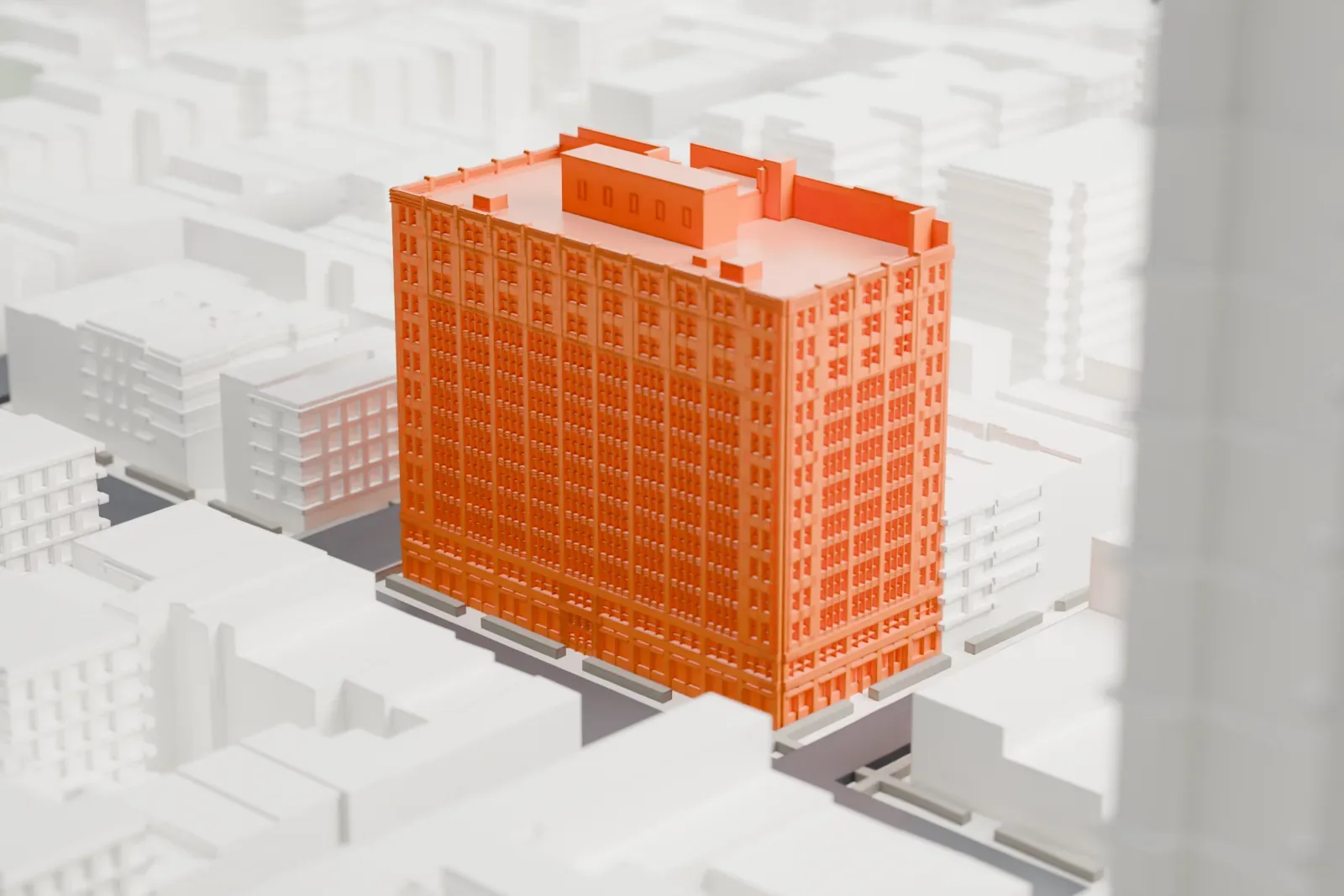 A white 3D print of the Film Center Building, a boxy tall block on a city corner, surrounded by lower buildings.