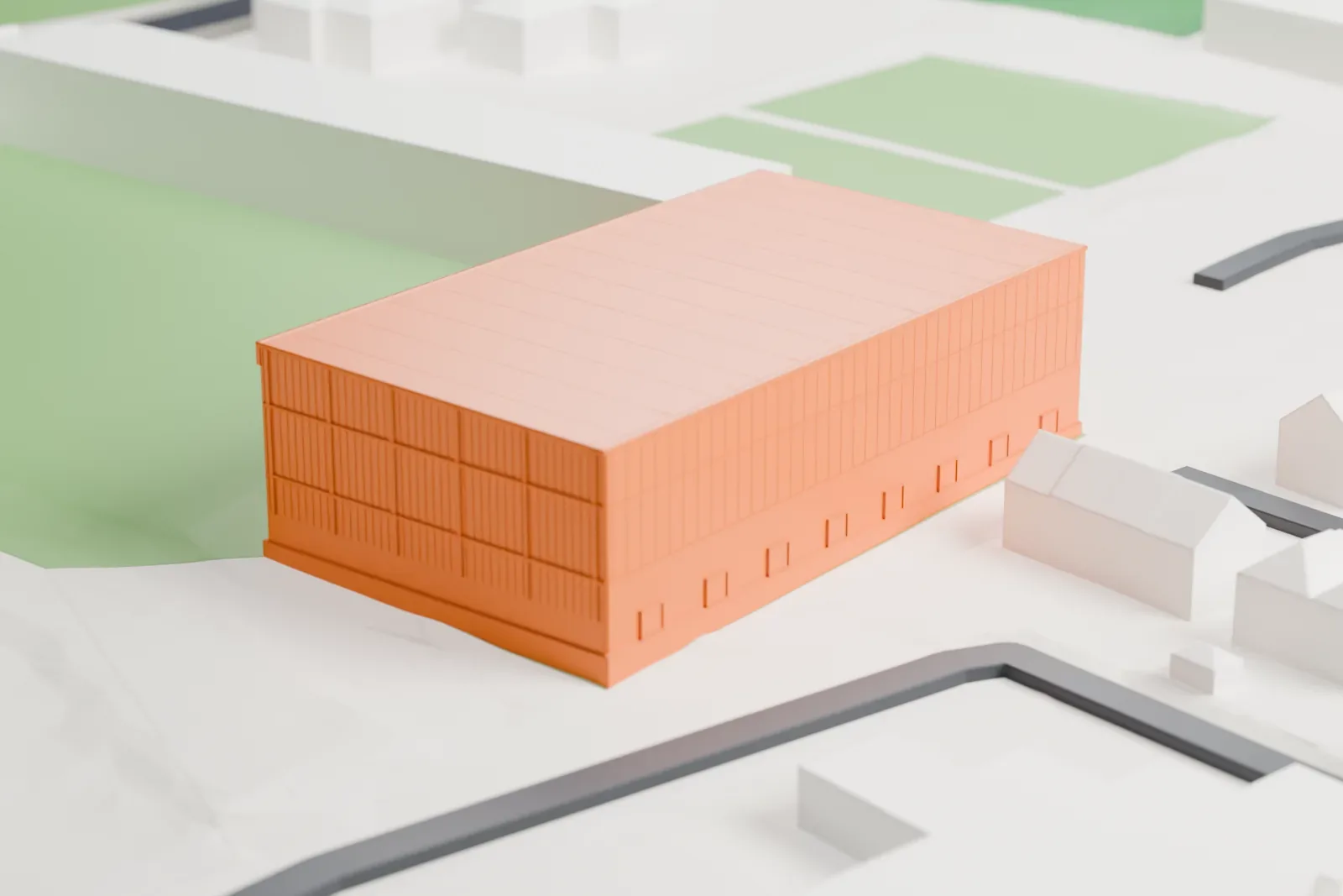 A white 3D print of Fir Park's South Stand, with its two seating tiers and wide canopy among the surrounding streets and buildings.