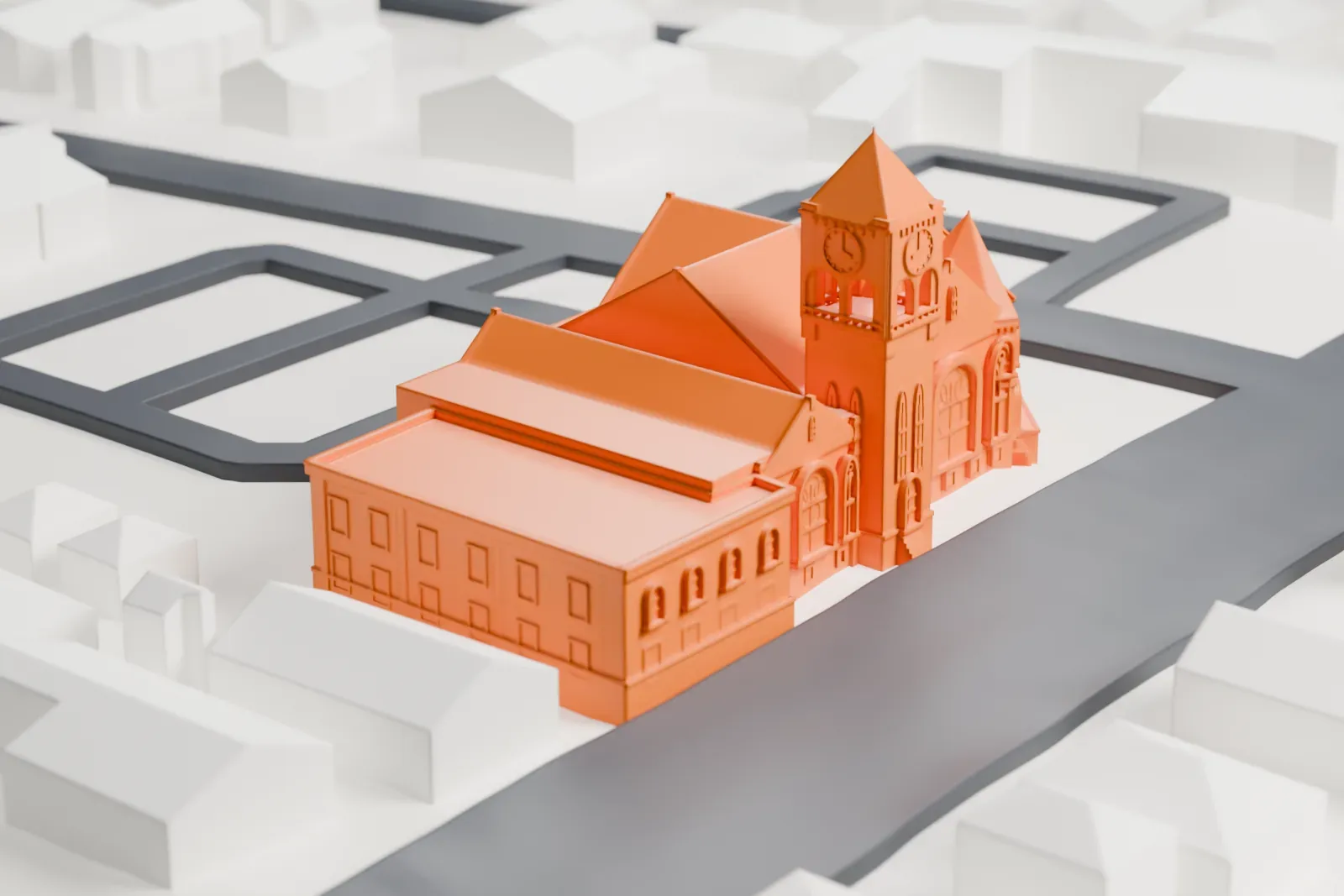 A white 3D print of a church with a tall clock tower and a multi-gabled roof, among houses and streets.