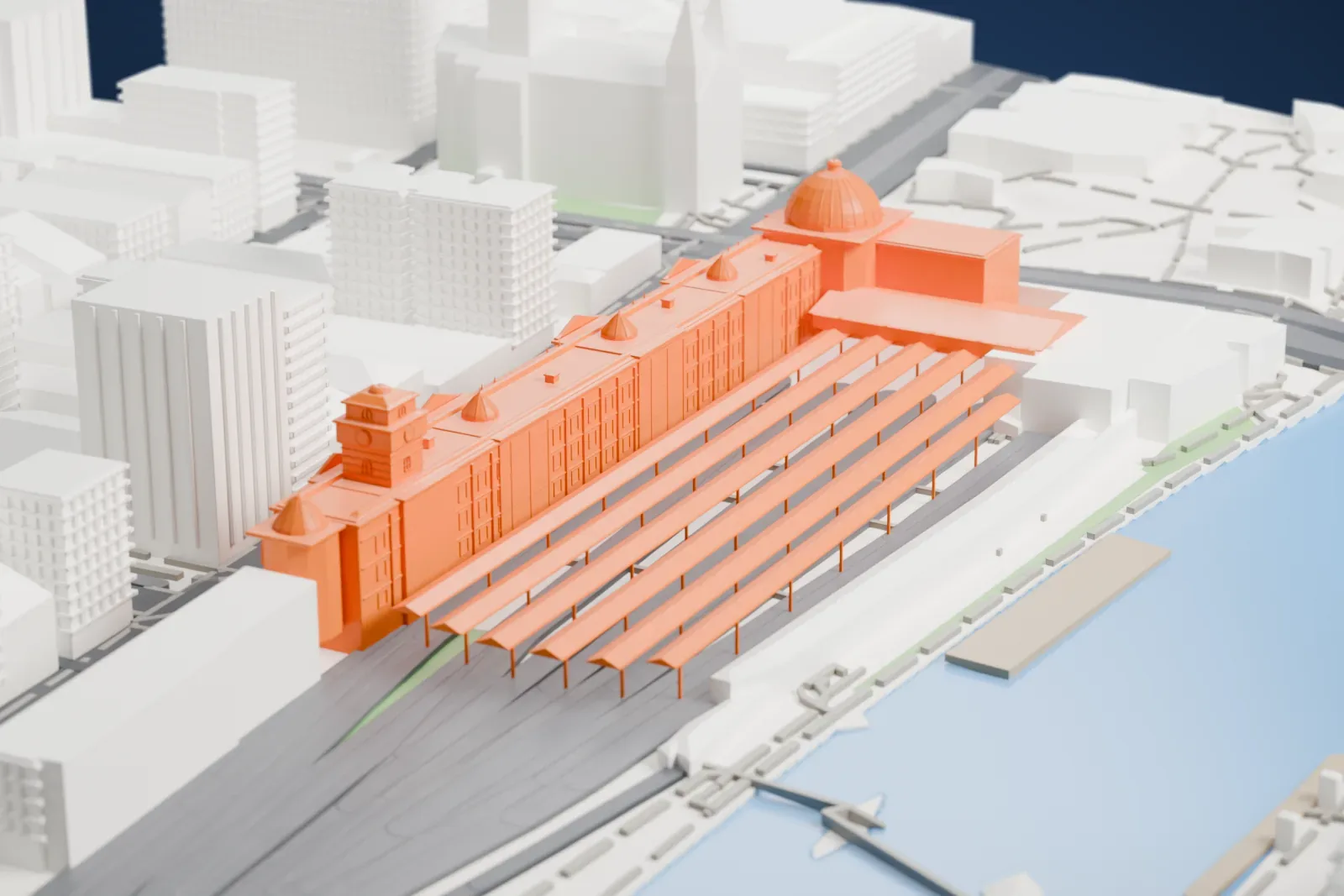 A white 3D print of Flinders Street Station, a long building with a large dome at one corner, a clock tower and a row of narrow platform roofs, beside a river and surrounded by tall city buildings.