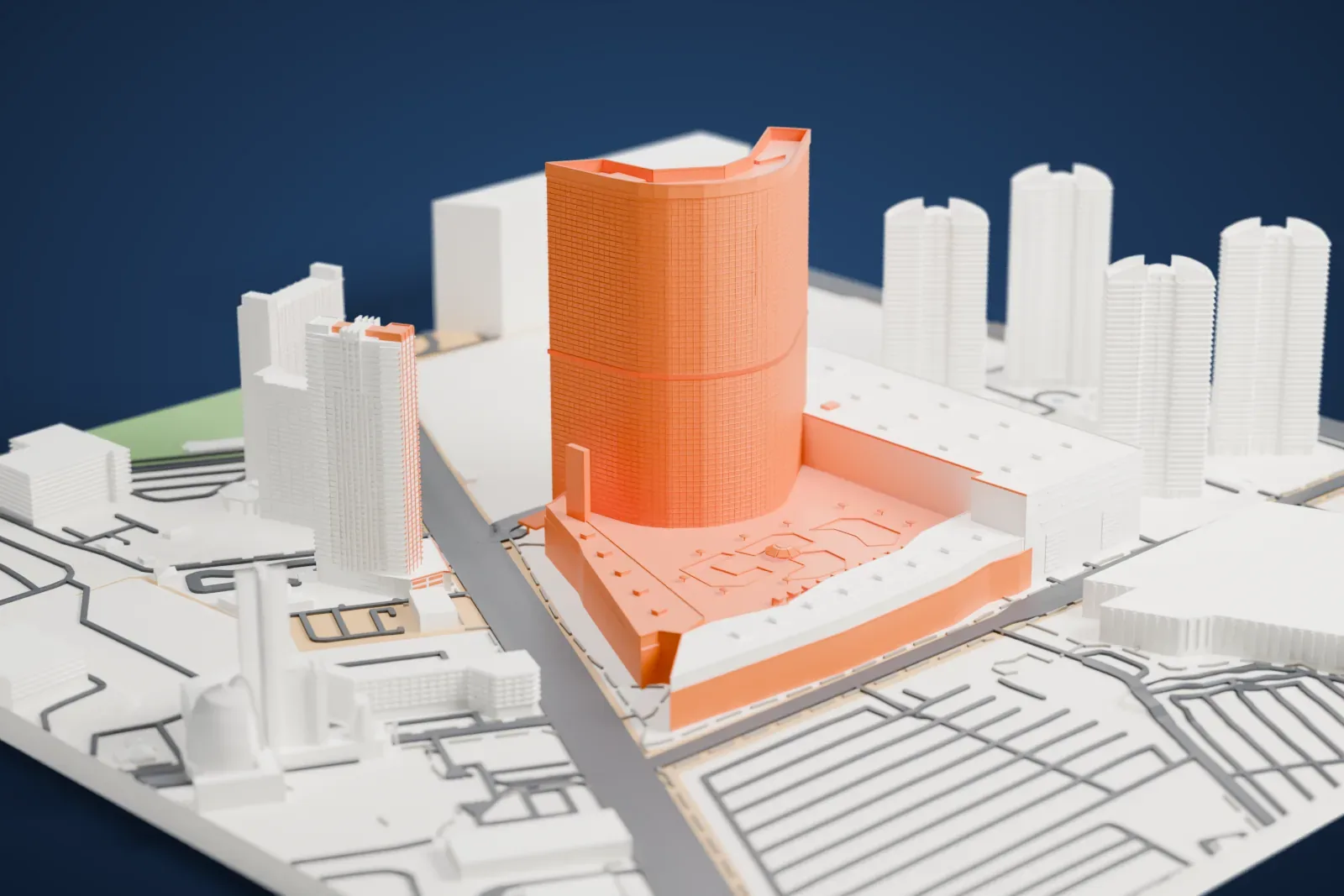 A white 3D print of Fontainebleau Las Vegas, a tall curved tower rising from a wide low podium, with other towers and streets around it.