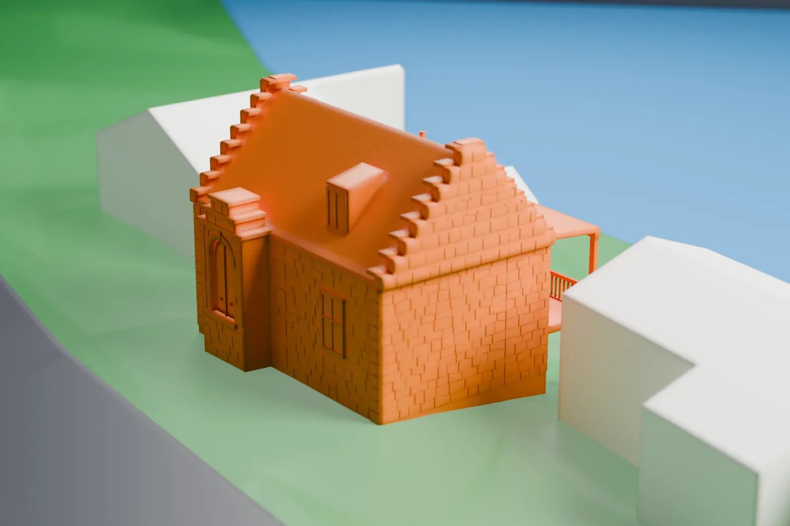 A white 3D print of the Former Wayside Chapel, a small rectangular stone building with stepped gable ends and a steep roof, set on a green slope beside a road.