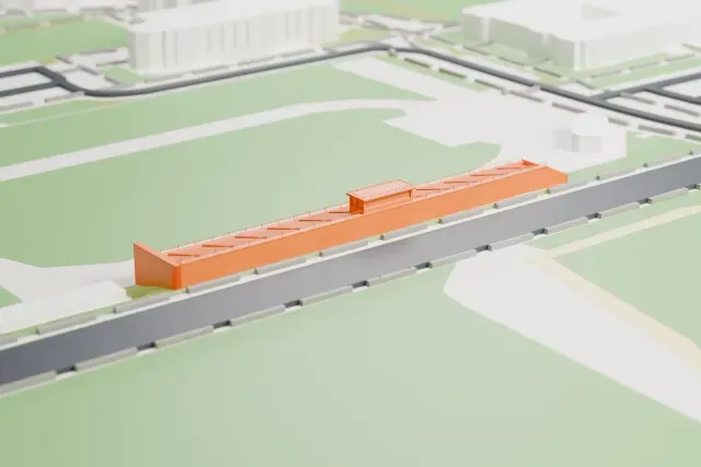 A white 3D print of Francis Olympic Field, one long low concrete stand with a small press box at its center, among surrounding streets and buildings.