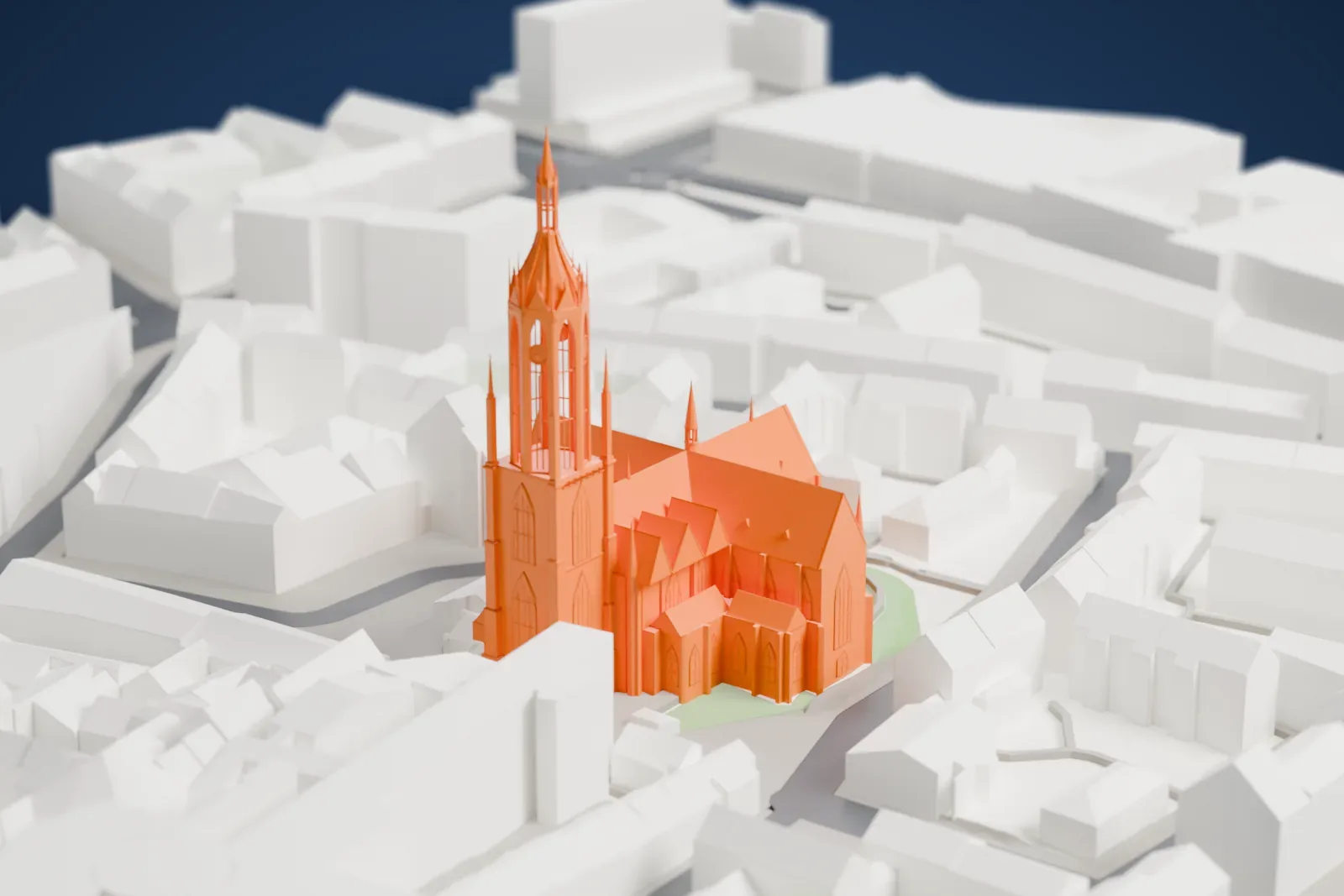 A white 3D print of Frankfurt Cathedral, a Gothic church with a tall spired tower, standing among surrounding city buildings.