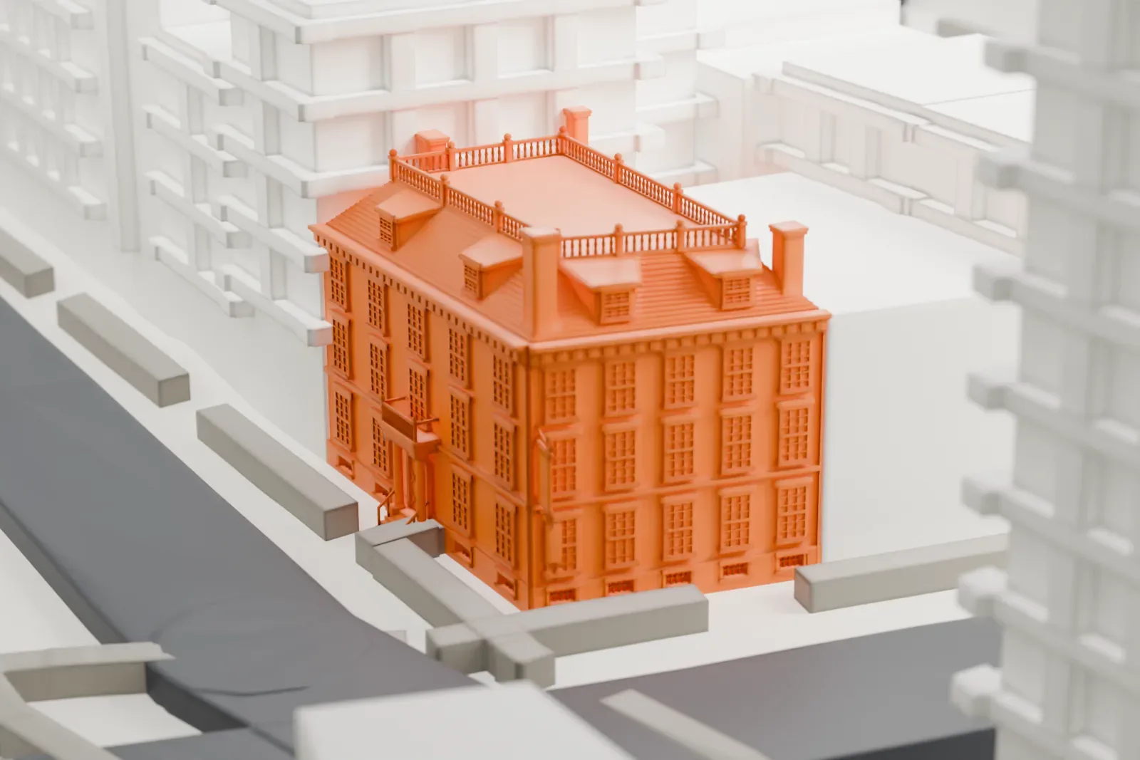 A white 3D print of Fraunces Tavern, a small building with a railed roof, squeezed between tall buildings beside a street.