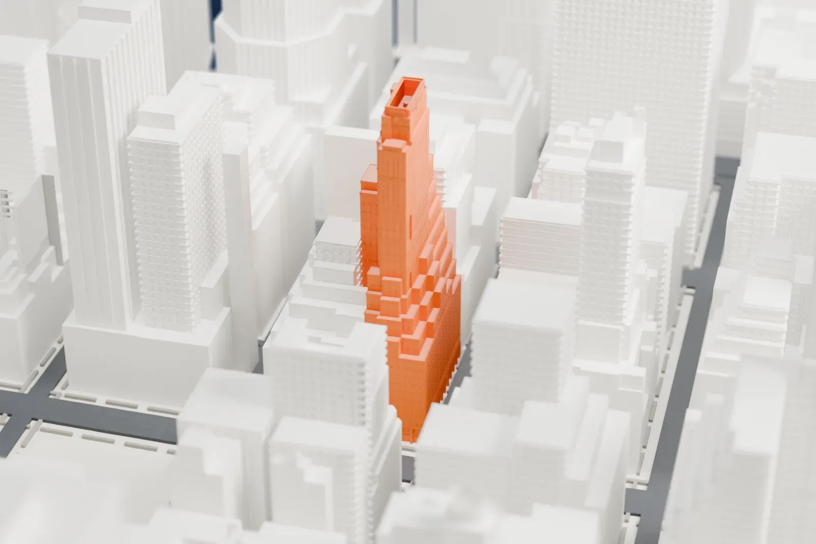 A white 3D print of the Fred F. French Building, a stepped tower with a slim upper tower, packed in among taller and lower Midtown buildings.