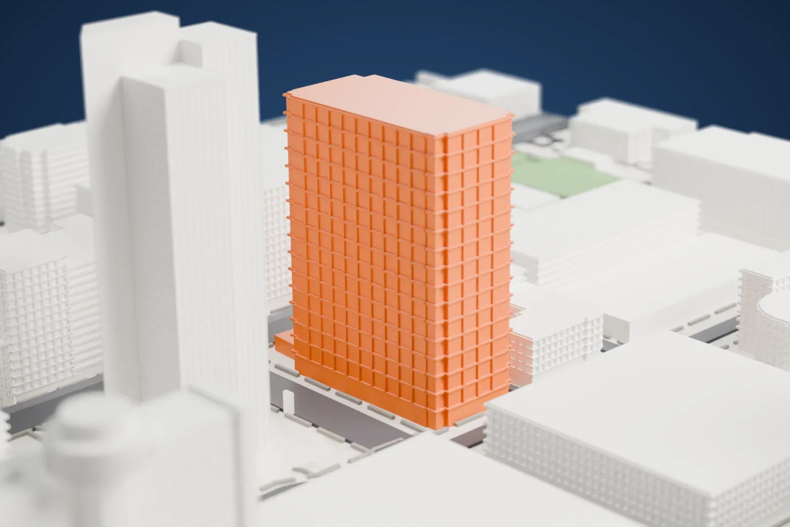 A white 3D print of the Freeport-McMoRan Center, a tall flat-faced tower with a lattice crown, between city streets and mid-rise buildings.
