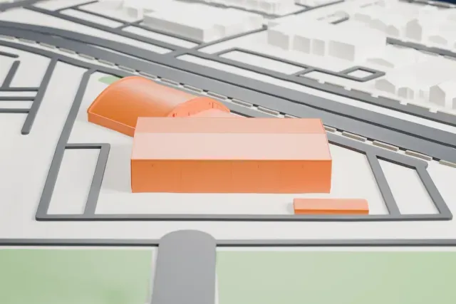 A white 3D print of the Frontiers of Flight Museum Hangars model in Dallas, with the streets around it.