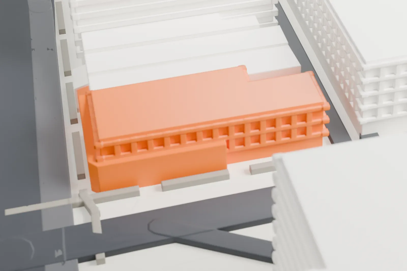 A white 3D print of the Fry Building, a two-story corner building among surrounding streets and buildings.