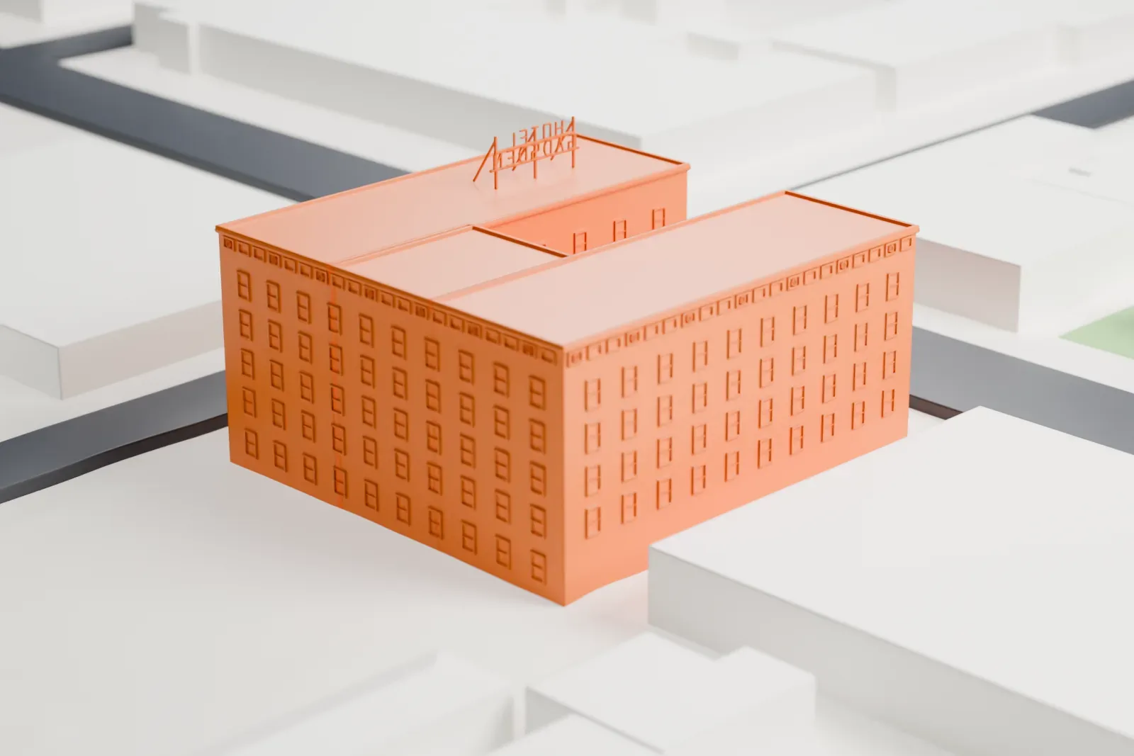 A white 3D print of the Gadsden Hotel, a boxy flat-roofed hotel with rows of small windows and a lettered sign on the roof, set among low buildings and city streets.
