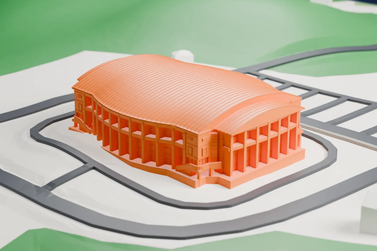 A white 3D print of Gangneung Gymnasium, a rounded indoor arena with a large ribbed curved roof and a colonnaded front, ringed by a road and open ground.
