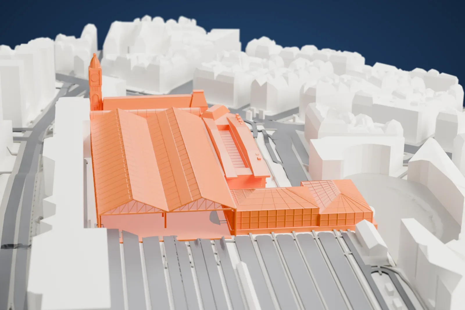 A white 3D print of Paris Gare de Lyon, a long range of station halls and train sheds with a clock tower, among the surrounding streets and buildings of the 12th arrondissement.